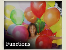 Photo of smiling young girl surrounded by large balloons - her arms held out to her sides - with word &quot;Functions&quot;